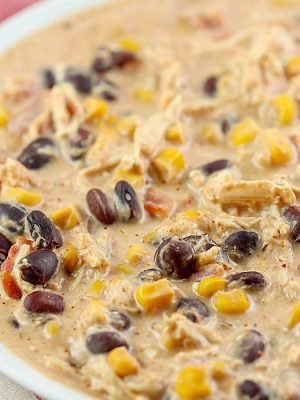 Throw this Crock Pot Cream Cheese Chicken Chili recipe into your slow cooker in the morning and you'll have a delicious chili dinner your whole family will love! My family's favorite creamy chili!