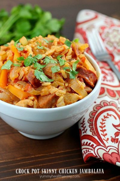 Crock Pot Skinny Chicken Jambalaya! Low calorie, tastes great and fills you up! Using lean proteins, (sliced chicken breasts and turkey sausage) sliced up onions and bell peppers, and rice mix and cooking it all in the slow cooker, makes this jambalaya recipe super easy. So tasty and with few ingredients!