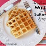 Plate with two waffles drizzled with homemade syrup.