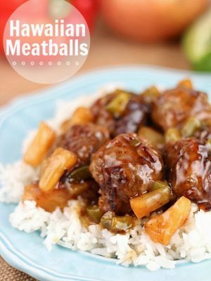 These Hawaiian Meatballs are made with a ground beef mixture that includes graham cracker crumbs, then cooked with an easy tangy sweet and sour sauce, pineapple tidbits and green peppers. 30 minute or less meal!