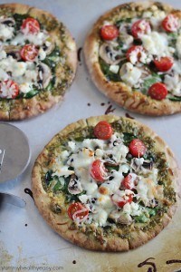 These Easy Pesto Pita Bread Pizzas use pita bread as the crusts and are spread with pesto and topped with veggies. Delicious and healthy lunch, dinner or snack! These Easy Pesto Pita Bread Pizzas use pita bread as the crusts and are spread with pesto and topped with veggies. Delicious and healthy lunch, dinner or snack!