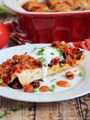 Healthy and delicious enchiladas with chicken, black beans and quinoa rolled inside flour tortillas. Guiltless and easy dinner!