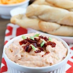 Delicious and super EASY breadsticks (made with Pillsbury Grands! Biscuits) and a warm bacon cheese dip to dunk them in!!