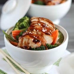 Delicious Chicken Teriyaki Bowls with chicken baked in a homemade teriyaki sauce layered on top of a bed of rice & veggies!