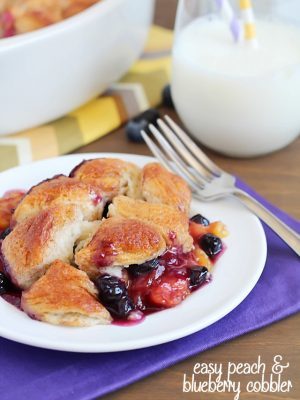 A quick and easy version of a classic cobbler by using refrigerated biscuits to create an easy topping over fresh peaches and blueberries. So delicious and EASY!