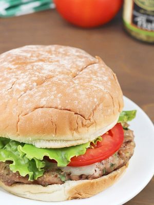 Flavorful Turkey Pesto Burger made with ground turkey, pesto, cilantro and green onions then topped with mozzarella and tomatoes - moist and delicious!