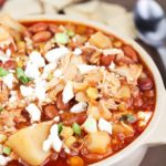 Yummy crock pot chicken chili stew with pinto beans, potatoes, corn, spices and topped with feta cheese. Easy prep and so delicious!