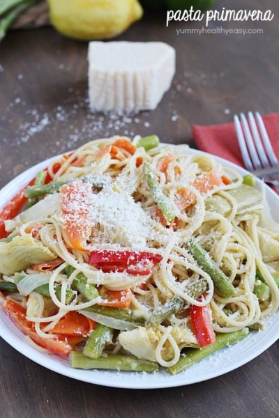 Pasta Primavera lightened up and filled with veggies for a healthy and light meatless dinner!