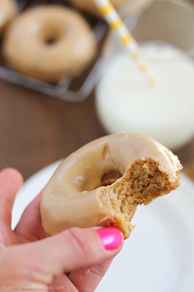 These Baked Apple Donuts with Maple Glaze are seriously the best baked donuts ever! Moist, apple-spiced flavor dipped in the tastiest maple glaze known to man. And only 196 calories per donut!