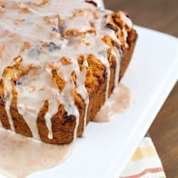 Chocolate Chip Pumpkin Loaf - so moist and delicious, with a spiced glaze drizzled over the top. Best pumpkin bread ever!