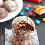 Chocolate Surprise Crinkle Cookies filled with pieces of your favorite candy inside and rolled in powdered sugar - the best way to use up any leftover candy!