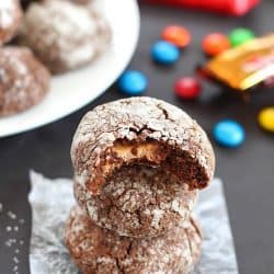 Chocolate Surprise Crinkle Cookies filled with pieces of your favorite candy inside and rolled in powdered sugar - the best way to use up any leftover candy!