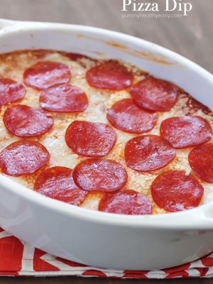 The most unbelievable pizza dip! A layer of herbed cream cheese, homemade sauce, cheese and then topped with pepperoni. AMAZING!