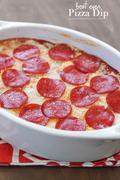 The most unbelievable pizza dip! A layer of herbed cream cheese, homemade sauce, cheese and then topped with pepperoni. AMAZING!