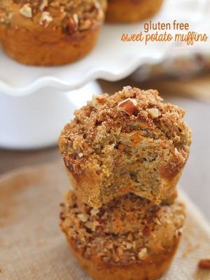 Gluten Free Sweet Potato Muffins (with cranberry sauce inside, too- perfect fall breakfast!) topped with a brown sugar-nut topping. So moist & delicious!