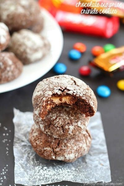 Chocolate Surprise Crinkle Cookies filled with pieces of your favorite candy inside and rolled in powdered sugar - the best way to use up any leftover candy!