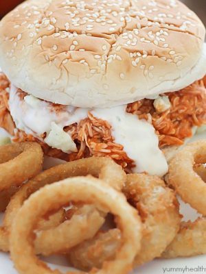 You will love these 3-ingredient Crock Pot Buffalo Chicken Sandwiches! Shredded buffalo chicken inside buns and smothered with blue cheese and hot sauce. So easy and absolutely delicious!