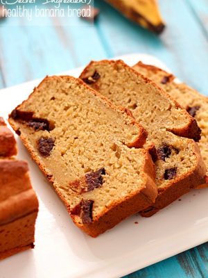 Healthy Banana Bread recipe made with a secret ingredient ;) and all in the food processor! It's moist, decadent and perfect for using up those ripe bananas laying on your counter.