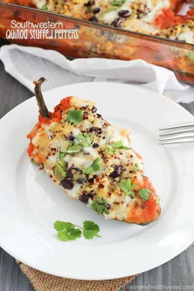 Southwestern Quinoa Stuffed Peppers Recipe - pasilla peppers filled with black beans, quinoa and spices then cooked in a flavorful tomato sauce. Vegetarian, gluten free, clean-eating and absolutely delicious!