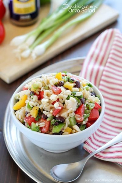 This Healthy Southwestern Orzo Salad recipe is full of veggies, black beans, orzo, & feta cheese all smothered in a delicious dressing! #ad