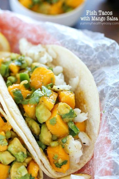 You will love these Fish Tacos with Mango Salsa! Corn tortillas filled with flaky white fish and topped with fresh mango and avocado salsa. Doesn't get better than that! #ad