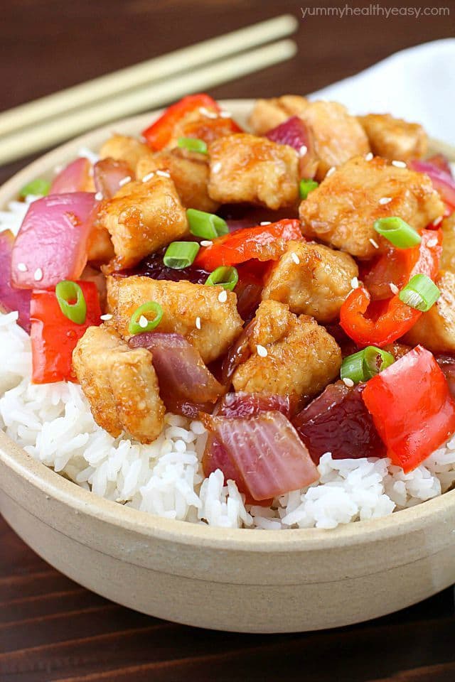 The most incredible Orange Chicken Stir Fry with pan seared chicken, red bell peppers, onion and a delicious sweet and savory sauce served over rice. So easy and so flavorful!