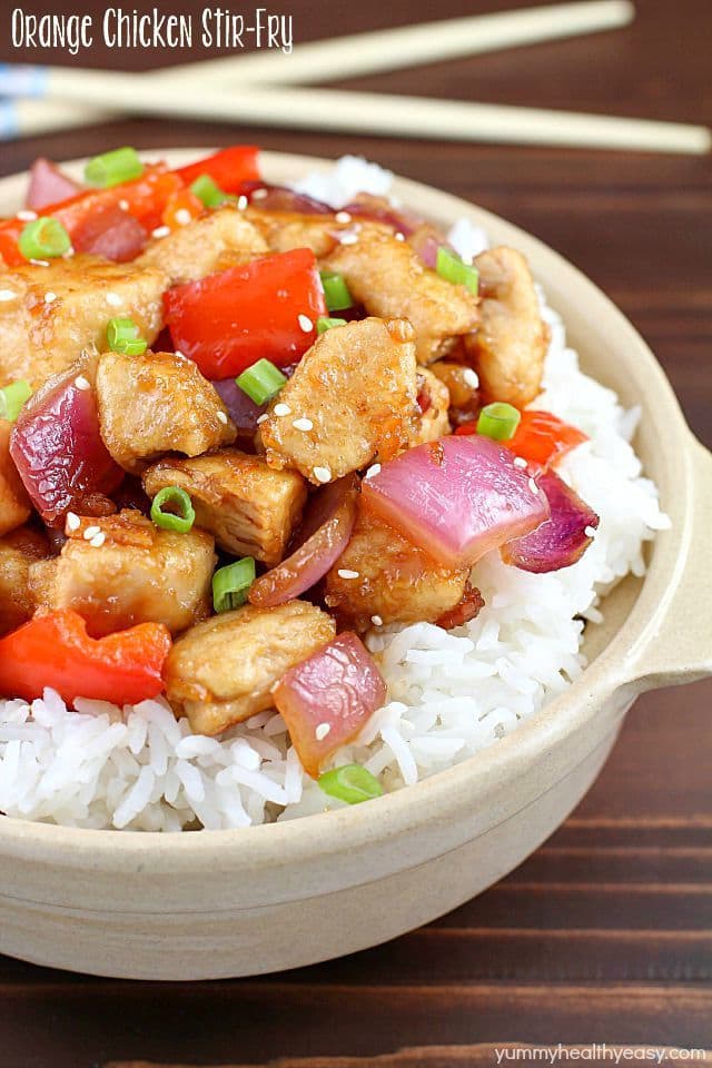 The most incredible Orange Chicken Stir Fry with pan seared chicken, red bell peppers, onion and a delicious sweet and savory sauce served over rice. So easy and so flavorful!