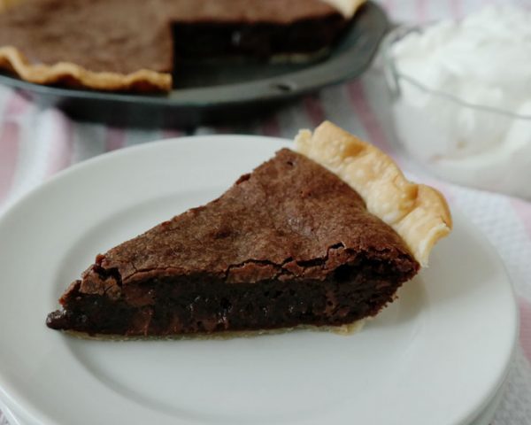 Easy Brownie Pie- taking brownies to the next level and creating an easy dessert-a flaky pie crust surrounds a rich brownie with a thin crust on top and in the middle a gooey, fudgy delight!
