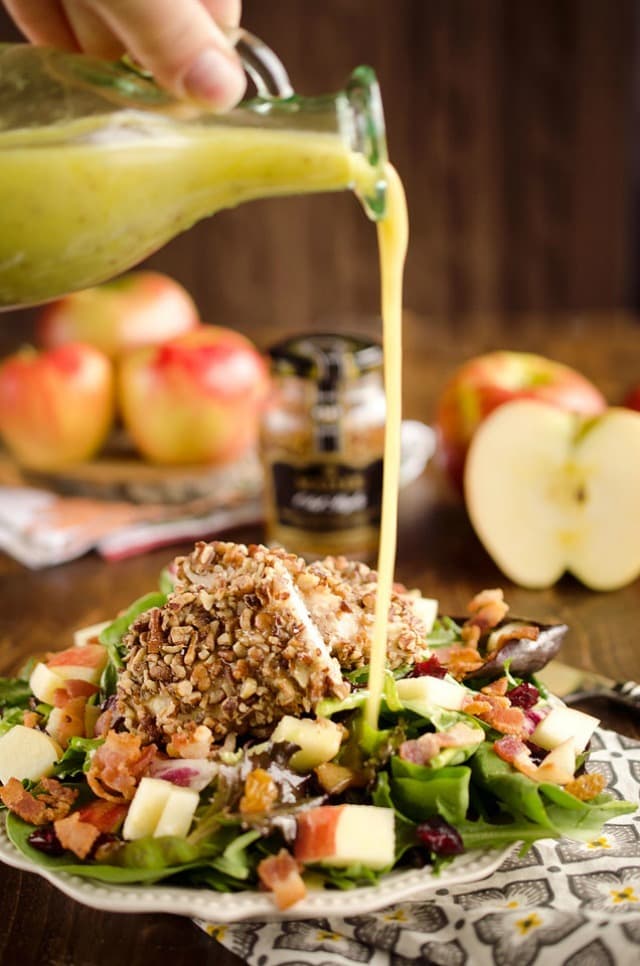 Harvest Salad with Pecan Crusted Chicken is full of great fall flavors including dried cranberries, golden raisins, bacon, chopped apples and a tender chicken breast crusted with toasted pecans.