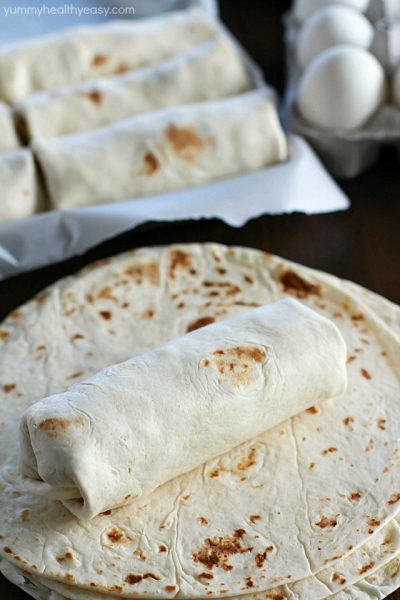 Freezer Breakfast Burritos are the best breakfast for busy people! Fix up a batch (so easy!) and throw in the freezer. When you're rushed to get out the door in the morning, throw a freezer breakfast burrito in the microwave and you're out the door with a healthy breakfast in minutes!