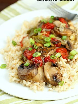 Baked "Smothered Chicken" may sound weird, but this is an incredibly easy and delicious one-pan, baked chicken dinner recipe that my family loves! It's healthy and high in protein and is low-carb & gluten-free without the side of rice. Super easy and no pre-cooking of the meat, just throw it all in the pan and bake! It comes out juicy and flavorful!