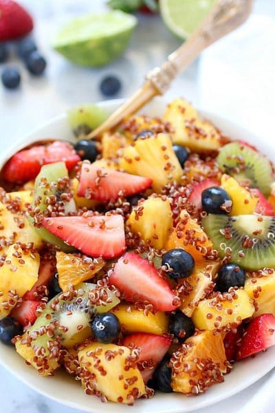 Quinoa Fruit Salad tossed in a Sweet Lime Dressing - a colorful, healthy side dish that goes with any meal! AD