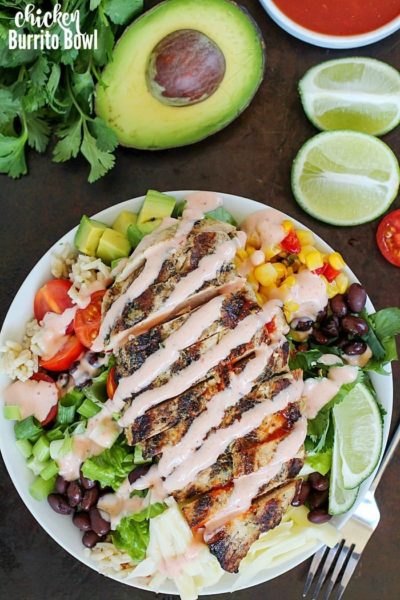 Ditch the tortilla and put everything you love about burritos into a yummy chicken burrito bowl! This recipe is so easy and adaptable to what you like. The best part of this recipe is the tender, marinated and grilled chicken! Add in any combo of brown rice, black beans, lettuce, corn, avocado, cheese, green onions, cilantro, tomatoes, salsa and a drizzling of ranch taco sauce. A fresh, delicious and healthy lunch or dinner!