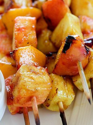 Fruit Skewers are grilled with a sweet cinnamon glaze and dipped in a delicious easy yogurt dip! You will go crazy for these grilled fruit skewers! AD