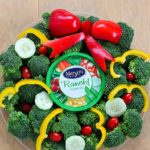Turn your boring veggie tray into something cute for the holidays with this Christmas Wreath Holiday Veggie Tray! It's simple to make but will leave a lasting impression on your guests at any holiday party! AD