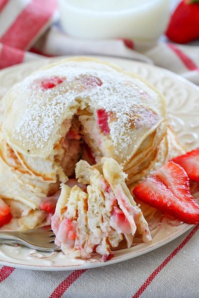 Start your day right with a stack of Strawberry Pancakes! They're a quick and easy to make breakfast the whole family will love!