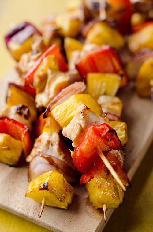 Teriyaki Chicken Kabobs are a healthy low-carb dinner bursting with flavor. These easy kabobs are prepared on the grill or in the oven and are loaded with lean chicken, bell peppers, onions and juicy pineapple for a balanced meal.