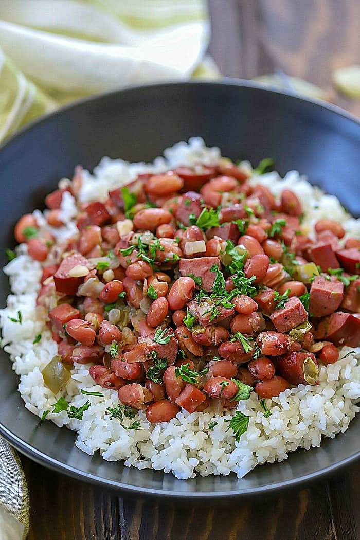 Make an incredible dinner tonight that everyone will love! These Cajun Red Beans & Rice Recipe is incredibly easy to throw together and tastes like it took a long time to make. So much flavor slow. cooked into one dish!