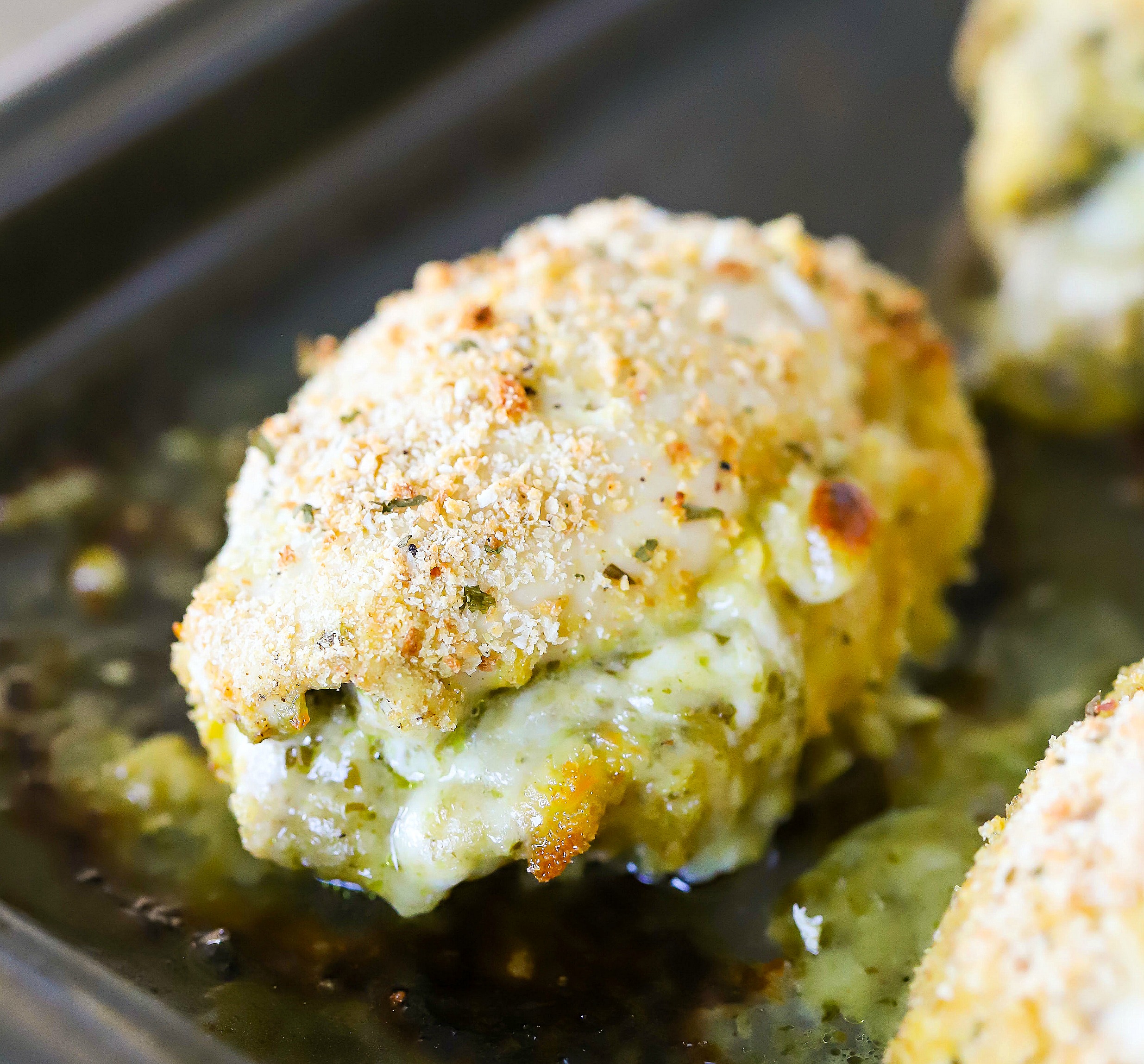 Square image of stuffed chicken on a plate