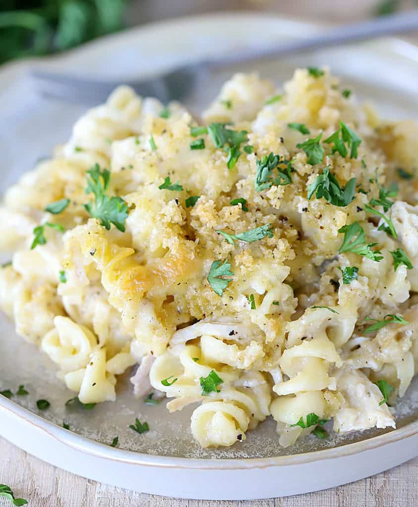 Ceramic plate with a large helping of chicken pasta casserole heaped on it.